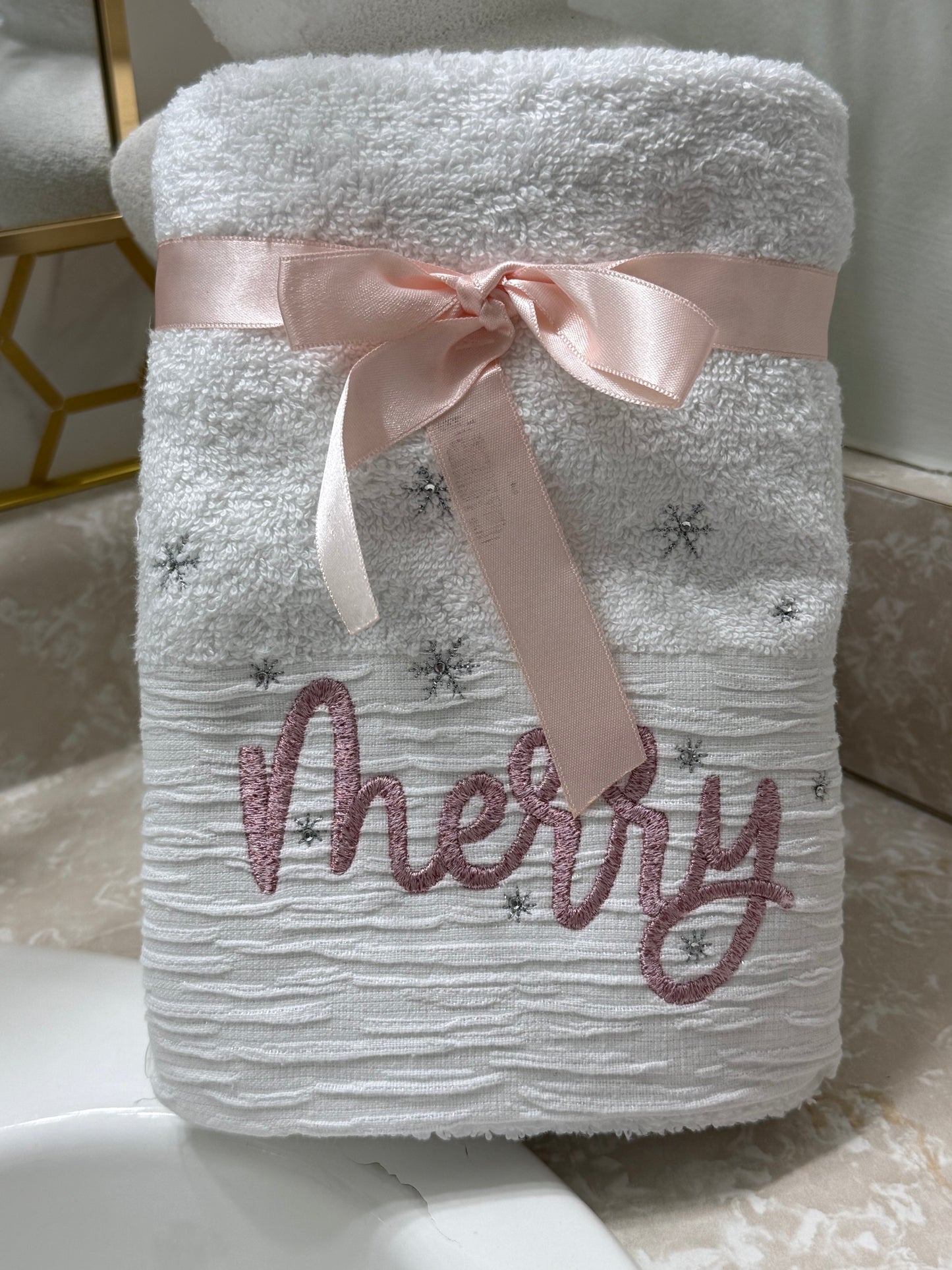 White Bathrooms Hand Towels Embroidered whit The Word Merry.