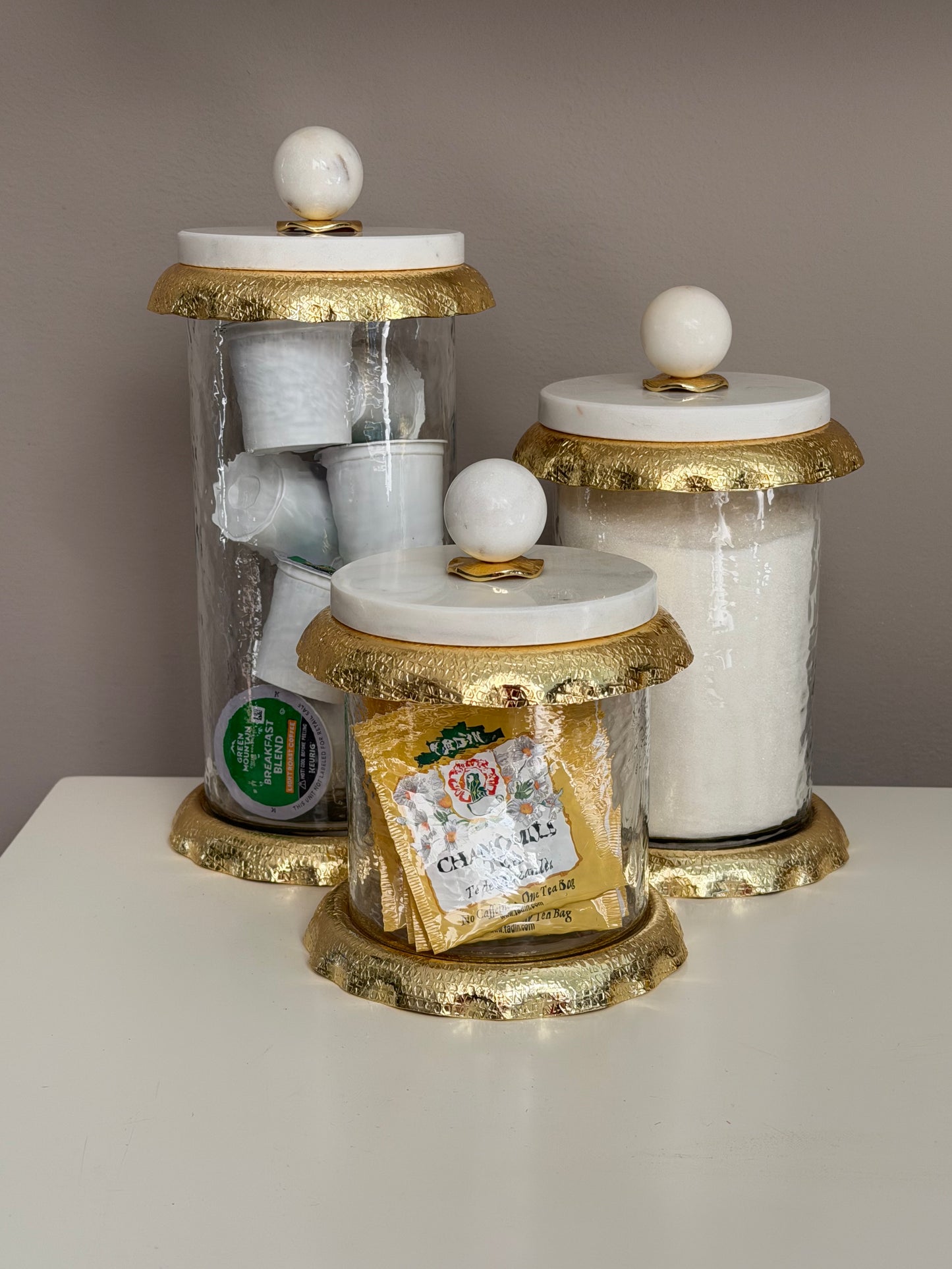 Set Of 3 Glass Canisters Whit Marble And Gold Lid .
